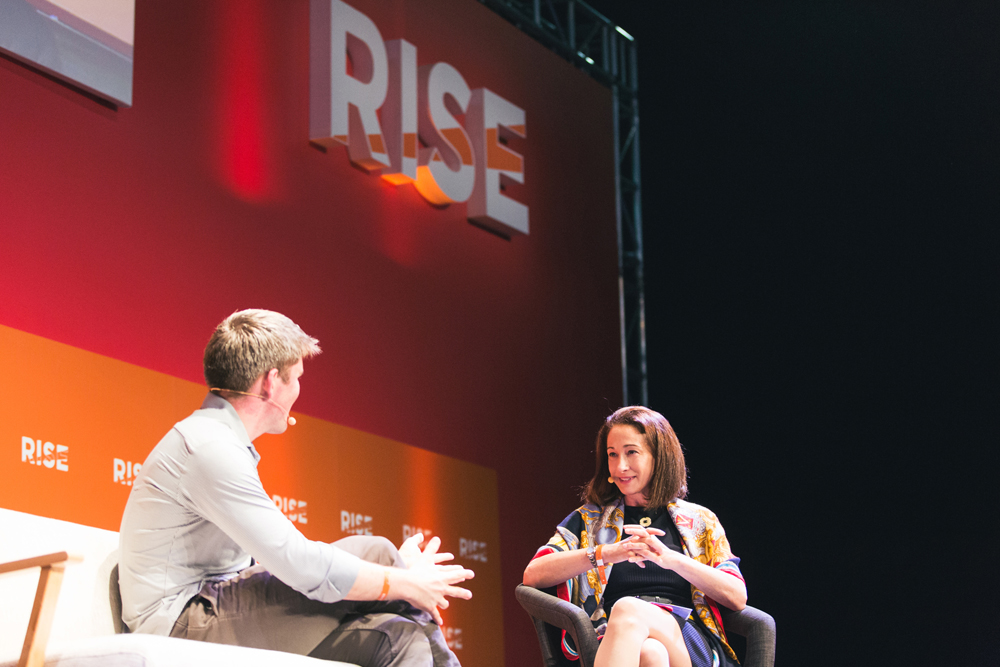 Melissa Guzy chatting with John Collison at RISE Conference